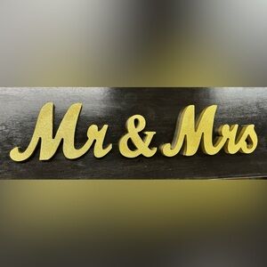 Mr & Mrs gold glitter sign.